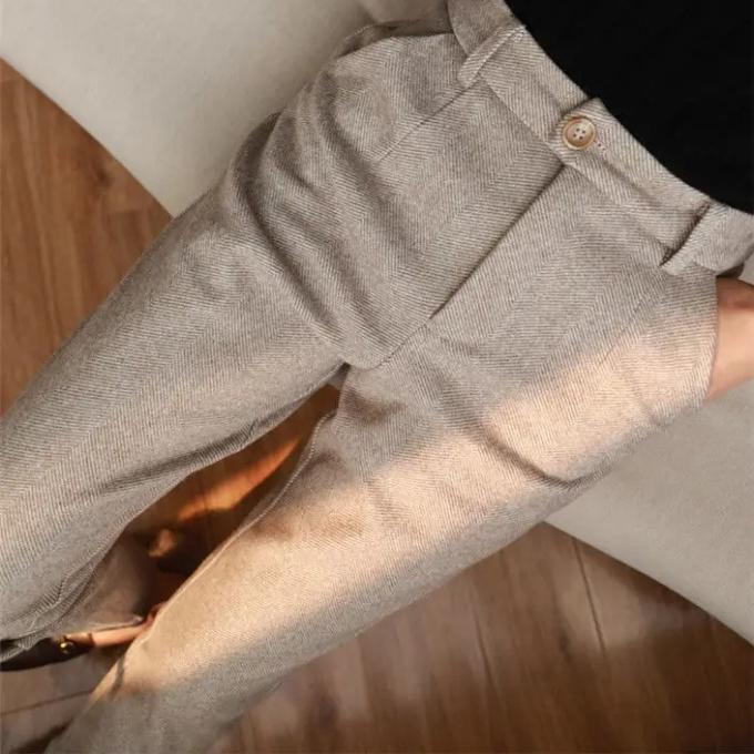 Versatile men's brown herringbone pants, a stylish wool blend for various professional settings.
