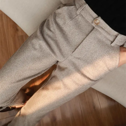 Versatile men's brown herringbone pants, a stylish wool blend for various professional settings.
