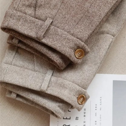 Men's dressy herringbone wool blend pants, tailored for a sharp and enduring classic look.