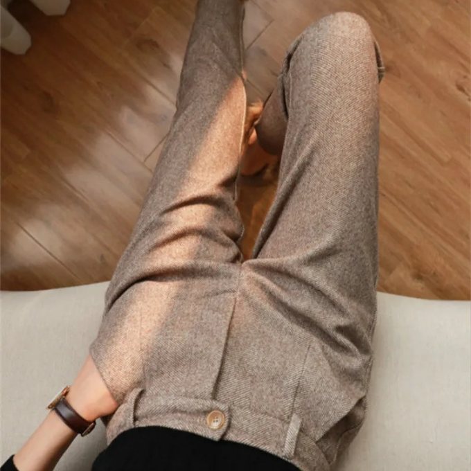 Sophisticated beige herringbone wool blend tailored pants, essential for men's professional attire.
