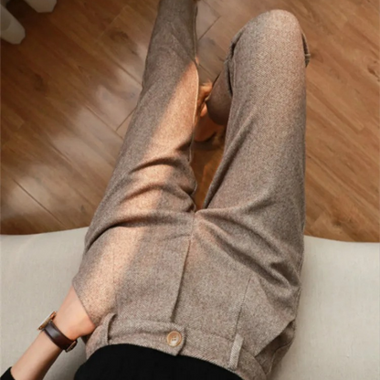 Sophisticated beige herringbone wool blend tailored pants, essential for men's professional attire.