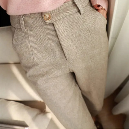 Durable wool blend men's herringbone trousers in a comfortable tailored fit, versatile style.