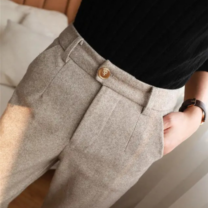 Men's classic brown herringbone dress pants, suitable for elegant business casual ensembles.