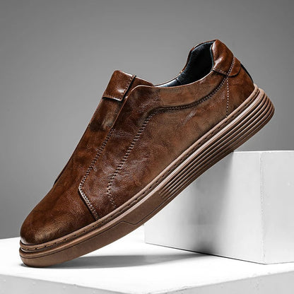 Black leather men's slip-on shoes, perfect for casual everyday comfort. Stylish and versatile mensfootwear.