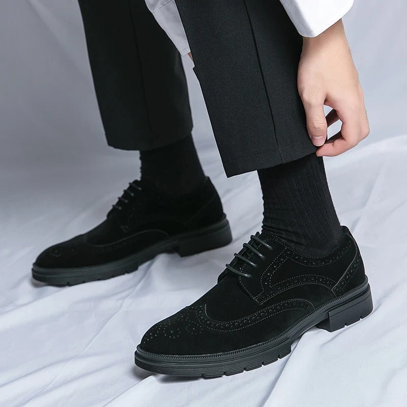 Elegant men's black suede brogues, versatile dress footwear perfect for office or casual smart occasions.