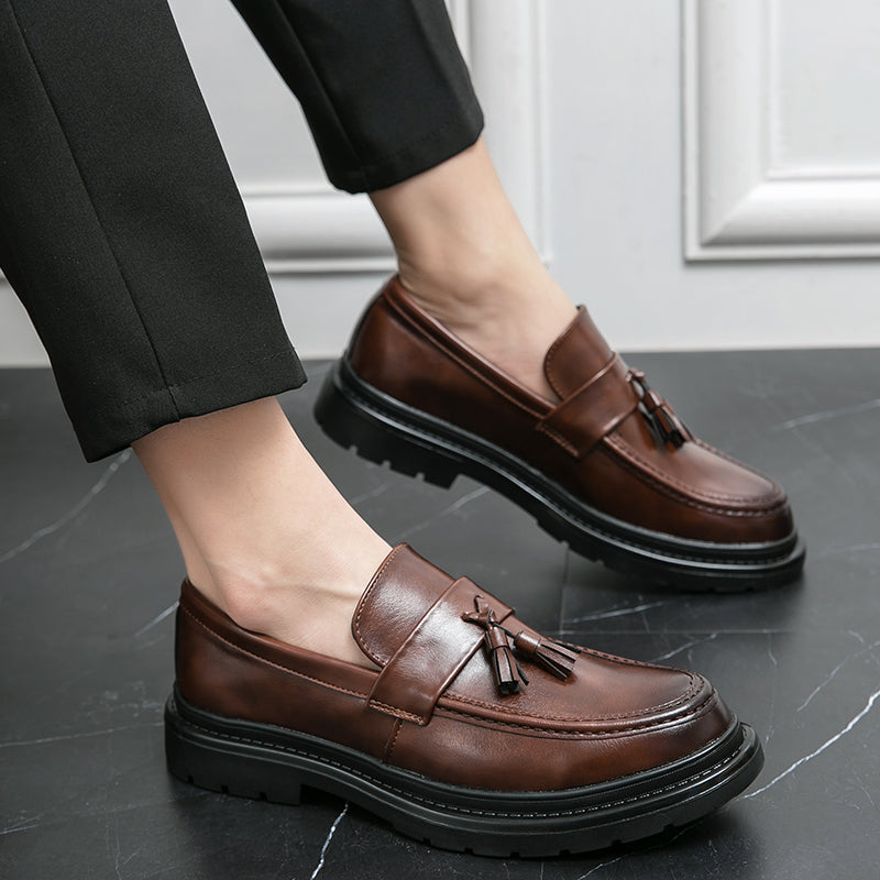 Stylish black men's tassel loafers, versatile formal footwear and casual walking shoes.