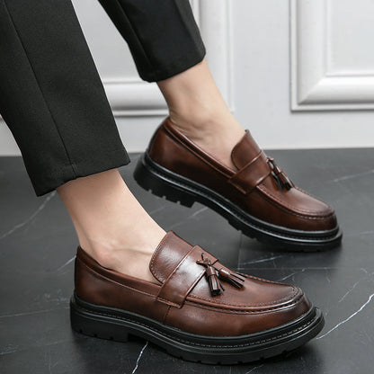 Stylish black men's tassel loafers, versatile formal footwear and casual walking shoes.