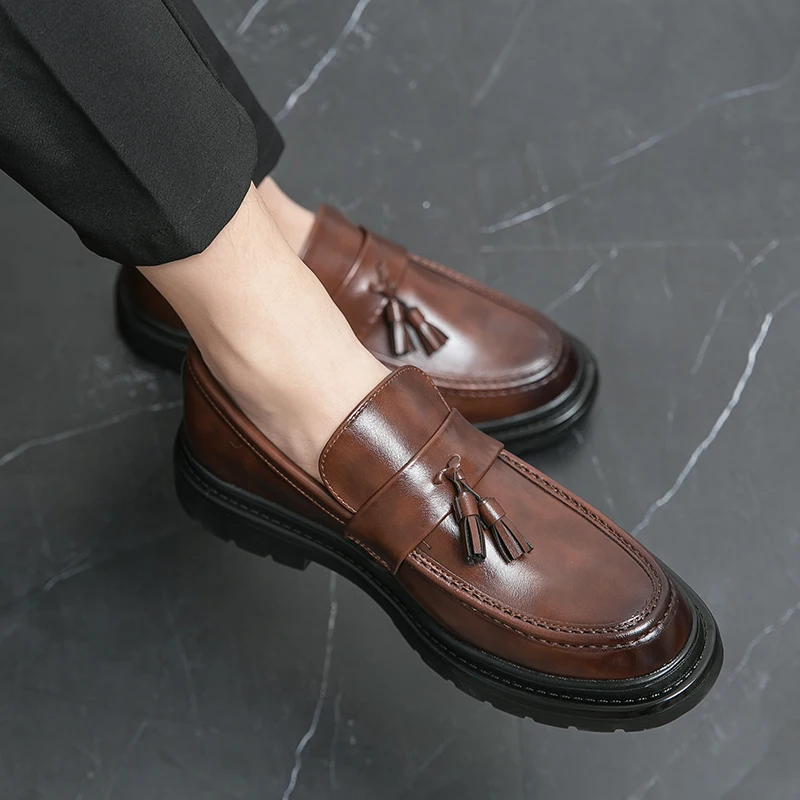 Elegant men's tassel dress shoes, sophisticated slip-on loafers for formal occasions.