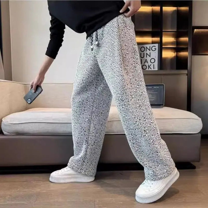 Man wearing comfortable brushed tapered knit pants; ideal for relaxing, casual outings, or off-duty comfort.