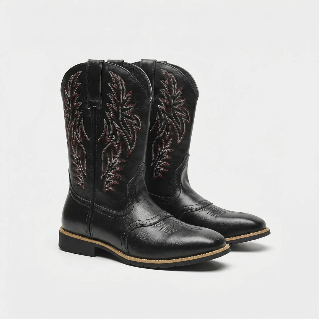 Brown men's cowboy boots, calf-length, featuring intricate western embroidery. Rugged slip-on design with a durable block heel.