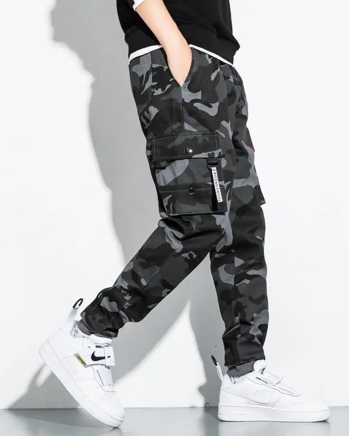 Comfortable men's tactical camo cargo joggers featuring multiple pockets for utility & style.