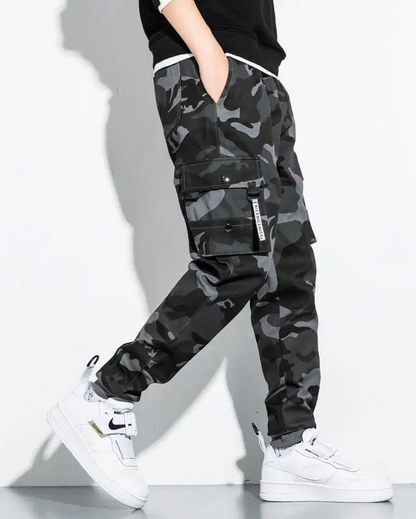 Comfortable men's tactical camo cargo joggers featuring multiple pockets for utility & style.