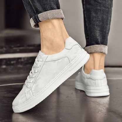 Assorted Men's Canyon Everyday Sneakers, showcasing black, beige, and white color options.