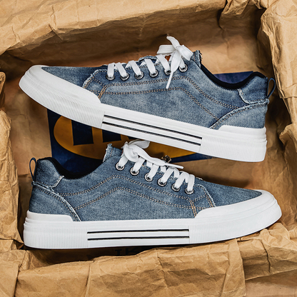 Men's casual blue denim sneakers, designed for stylish everyday comfort and contemporary streetwear.