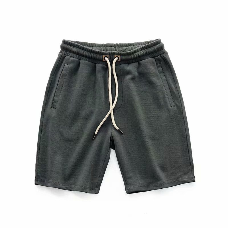 Khaki men's casual terry shorts, ideal for summer or athletic wear. Drawstring comfort.