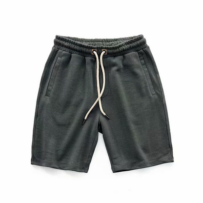 Khaki men's casual terry shorts, ideal for summer or athletic wear. Drawstring comfort.