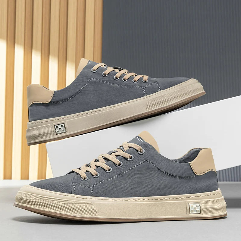 Stylish black men's sneakers, lightweight & durable for casual everyday walking comfort.