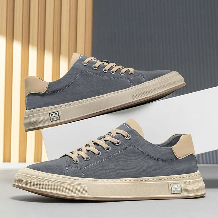 Stylish black men's sneakers, lightweight & durable for casual everyday walking comfort.