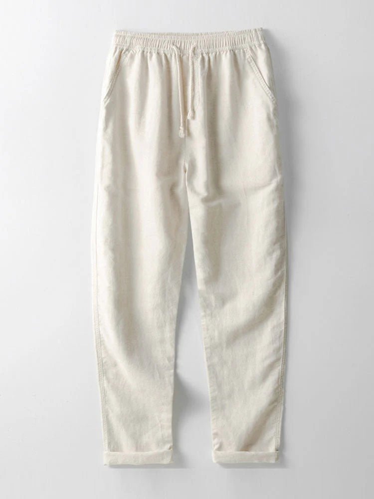 Relaxed men's outfit set; short-sleeve rolled cuff shirt & lightweight pants for easy summer style.