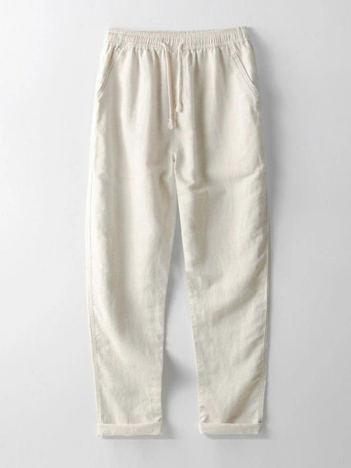 Relaxed men's outfit set; short-sleeve rolled cuff shirt & lightweight pants for easy summer style.