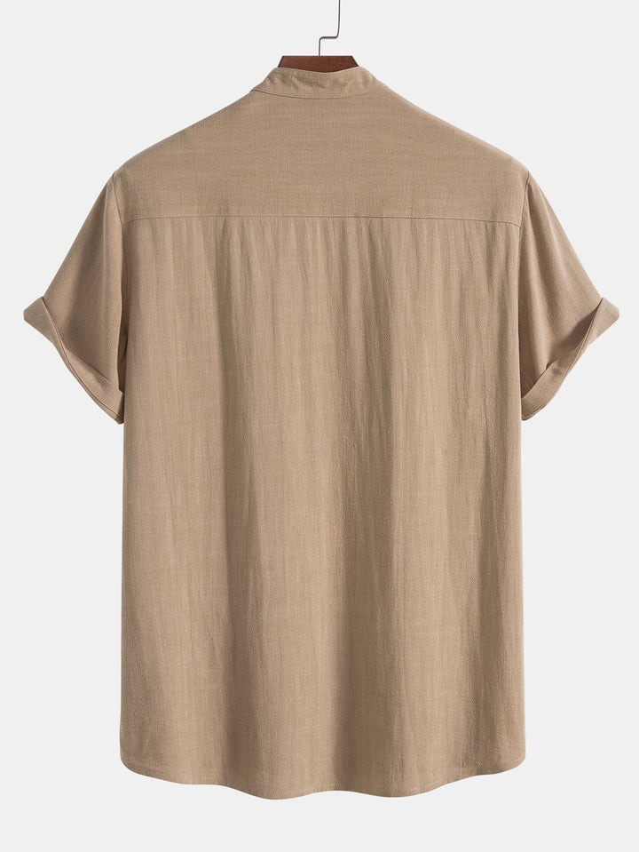Men's vacation apparel: a comfortable rolled cuff shirt & pants two-piece set for leisure.