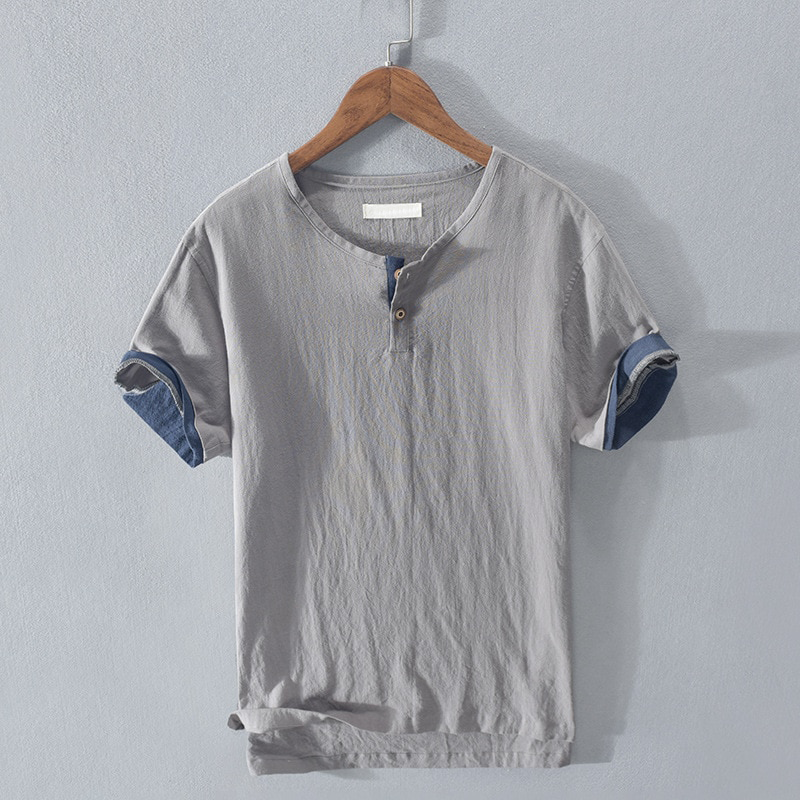 Comfortable short-sleeve men's henley top, ideal for summer fashion. Breathable & lightweight casual wear.