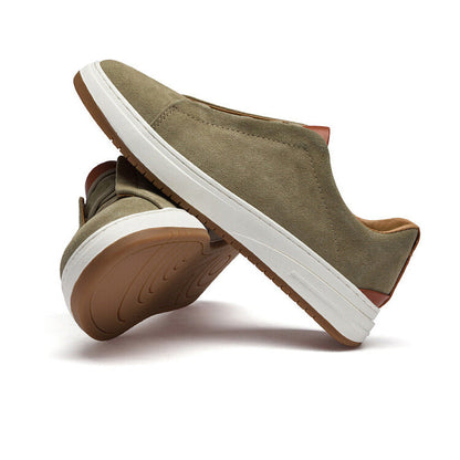 Dark grey men's slip-on sneakers, essential comfortable footwear for daily casual versatility.