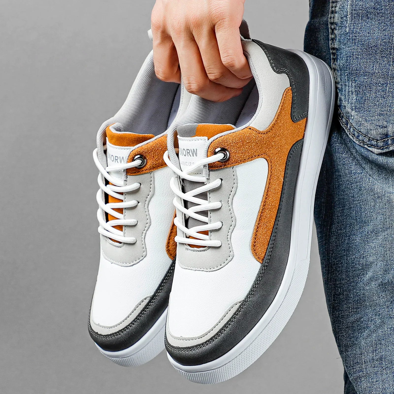 Stylish brown men's casual sneakers with elegant suede accents, perfect for everyday comfort & lace-up fit.