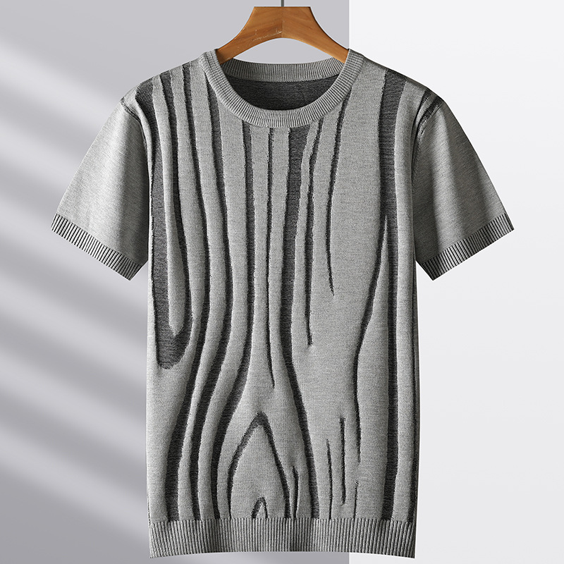 Close-up of the wood grain textured knit fabric on a men's stylish tee. Soft, comfortable, and modern design.