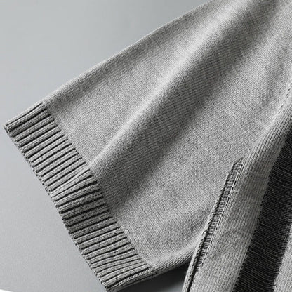 Model wearing a charcoal wood grain textured knit tee for men. Modern, casual, and soft comfort wear.