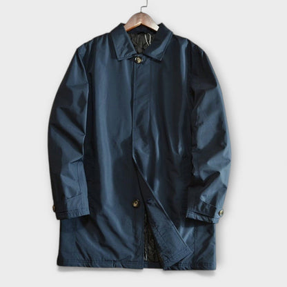 Sleek blue men's trench coat, a versatile overcoat for business casual and classic men's outerwear fashion.