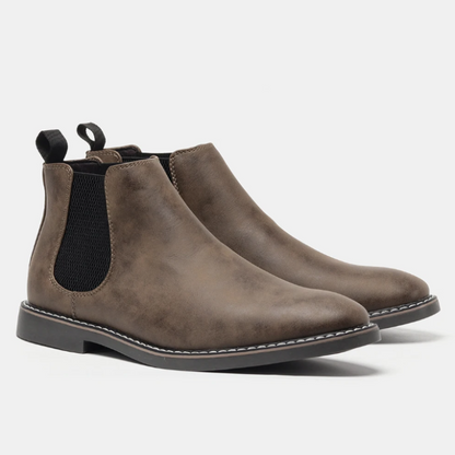 Elegant men's fashion Chelsea boots, enhancing any outfit with their timeless slip-on design. Black leather.