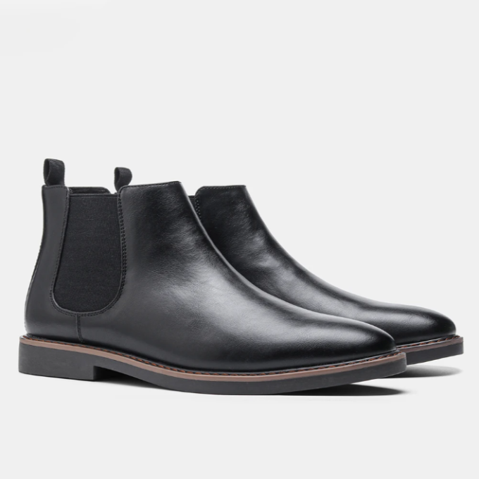 Close-up of elastic side panel on comfortable men's slip-on Chelsea boots for an easy fit. Quality construction.