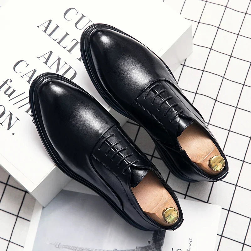 Classic men's formal black leather dress shoes for weddings, business attire, and elegant office fashion.