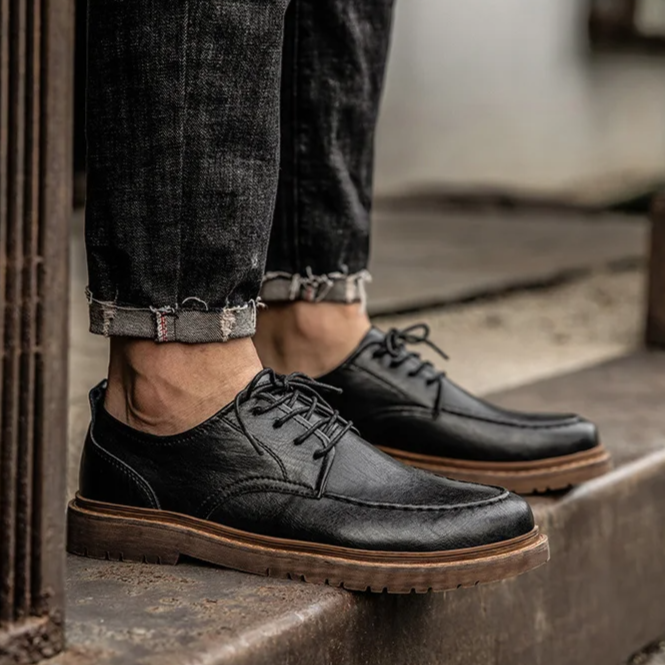 Men's classic lace-up Derby dress shoes in black, suitable for formal occasions or comfortable everyday casual wear.