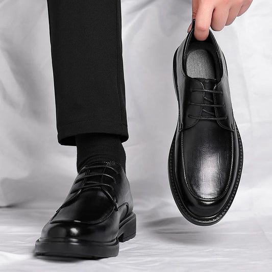 Men's classic black leather lace-up oxford dress shoes for formal events and office attire.