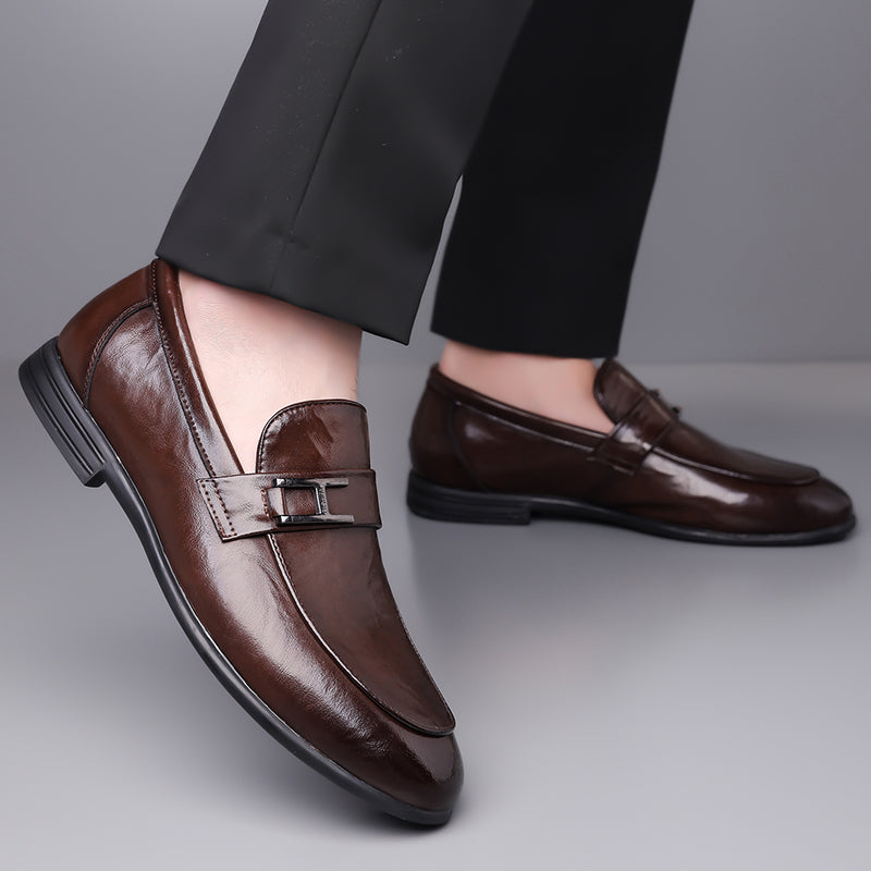 Textured brown leather men's lace-up oxford shoes for classic formal and office attire.