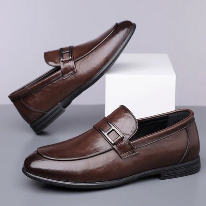 Side view of men's polished black leather oxford dress shoes, highlighting classic style & craftsmanship.