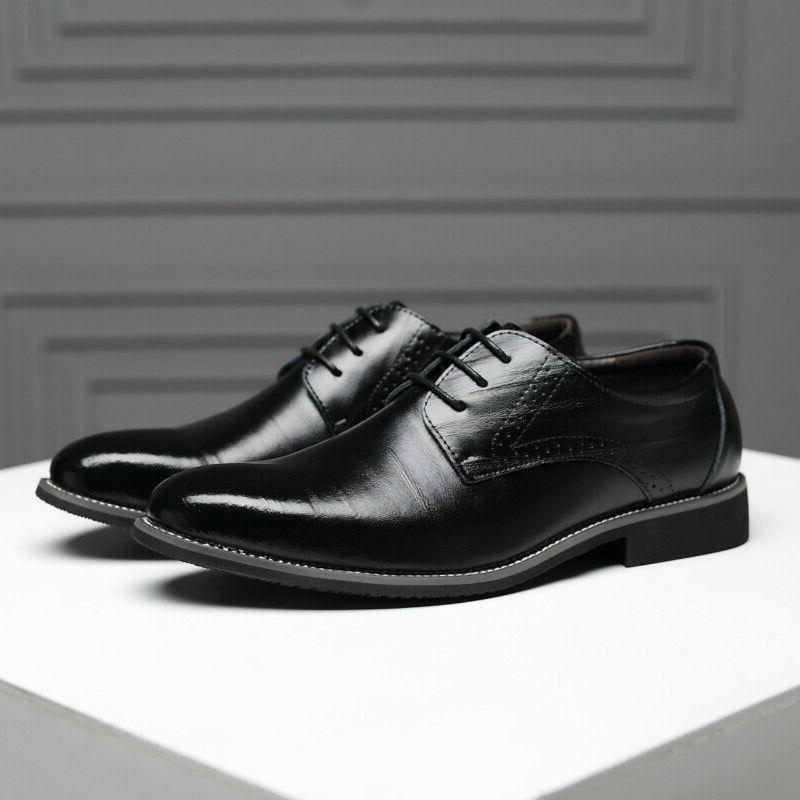 Elegant stacked heel detail on men's classic black Oxford formal dress shoes.