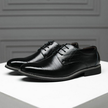 Elegant stacked heel detail on men's classic black Oxford formal dress shoes.