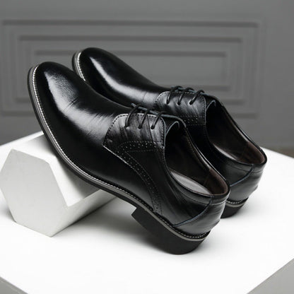 Men's black Oxford dress shoes worn with business attire, showcasing a polished, professional look.
