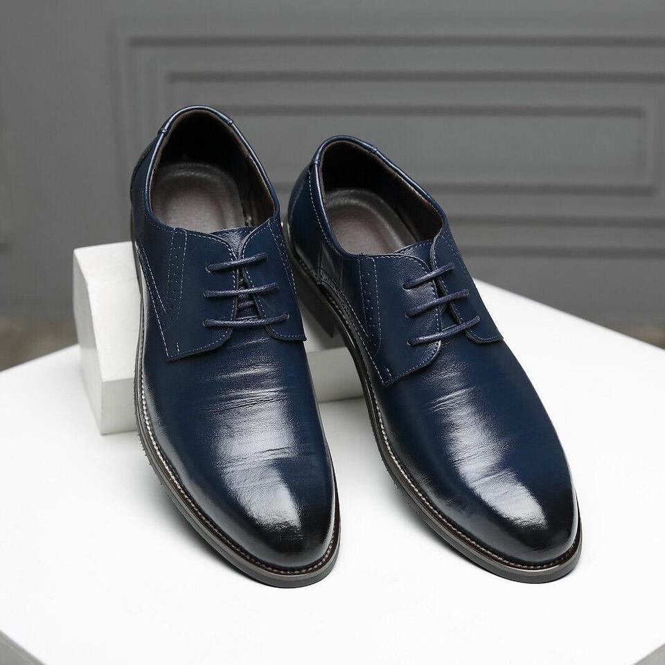 Men's classic brown leather Oxford dress shoes, ideal for sophisticated business & formal attire.