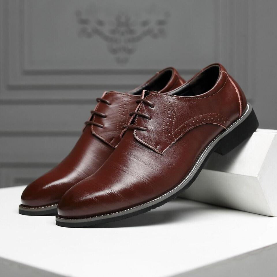 Stylish lace-up detail on men's black Oxford dress shoes, enhancing classic formal footwear.