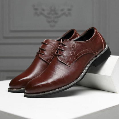 Stylish lace-up detail on men's black Oxford dress shoes, enhancing classic formal footwear.