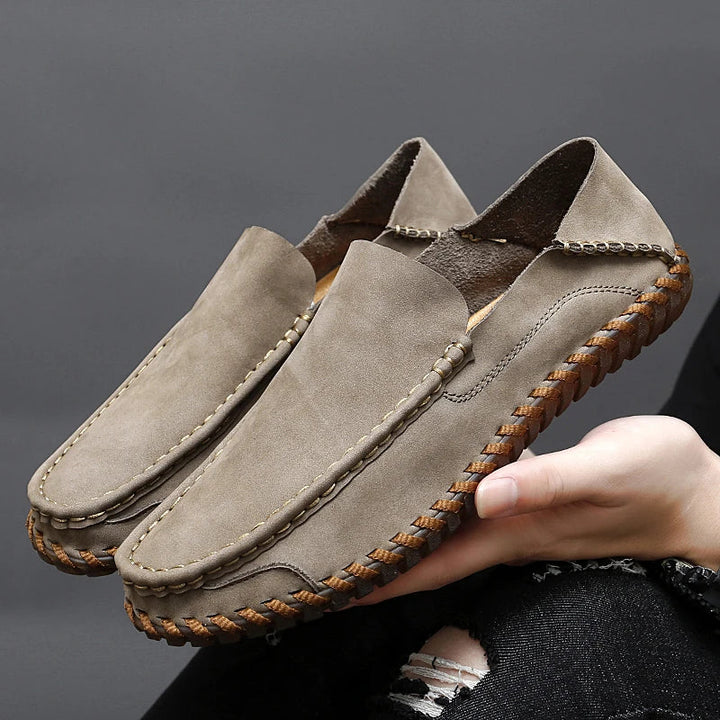 Stylish men's beige slip-on loafers, classic casual footwear for modern fashion.