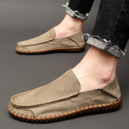 Versatile men's brown dress loafers, offering comfortable slip-on style.