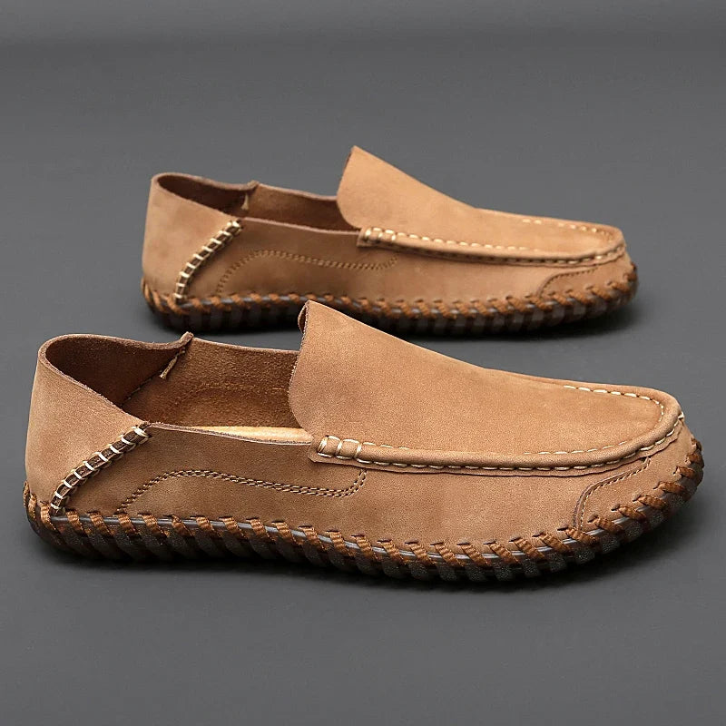 Classic men's beige slip-on loafers, blending casual comfort with refined style.