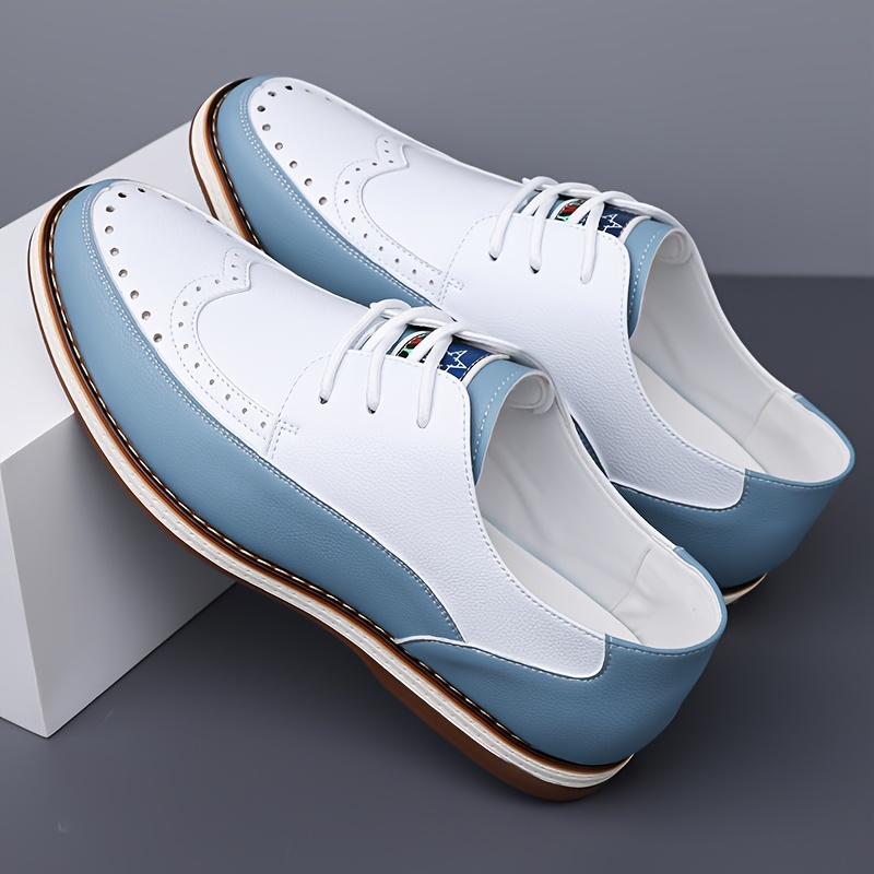 Top-down view of men's elegant blue brogue dress shoes, showcasing timeless design and comfortable fit.