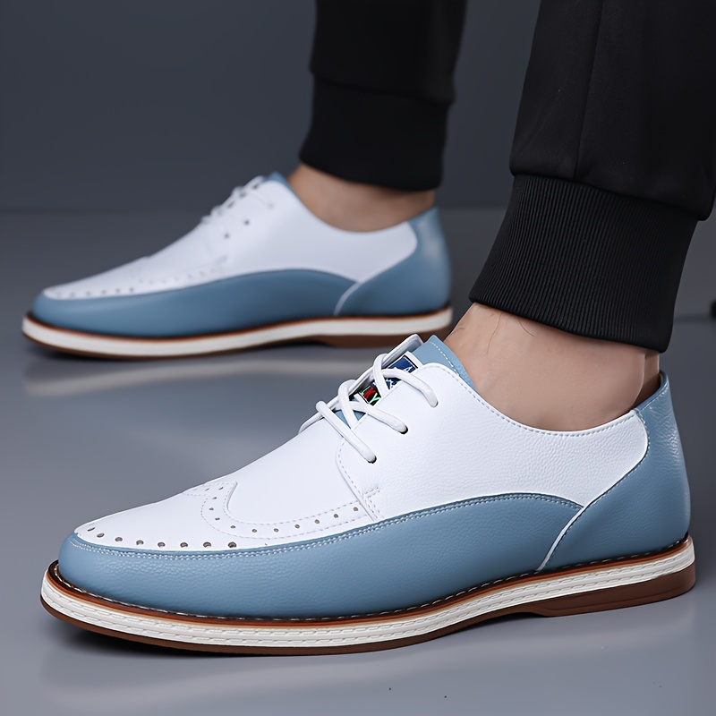 Heel & sole detail on men's blue brogue formal shoes, emphasizing durability, grip & cushioned comfort.