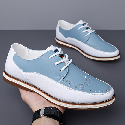 Side view of lightweight men's blue brogue shoes, showcasing classic style and comfortable sole.